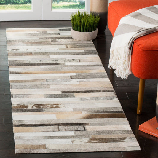 Tapis en cuir moderne SAFAVIEH fait main en atelier Tennille