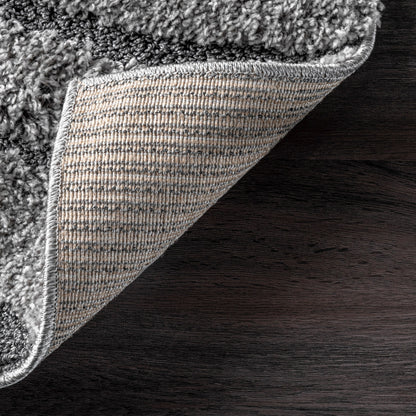 Tapis à poils longs Nuloom Krista contemporain à motifs tourbillonnants