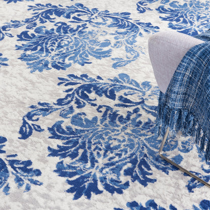 Tapis Nourison Whimsicle style campagne française, motif botanique, ivoire et marine