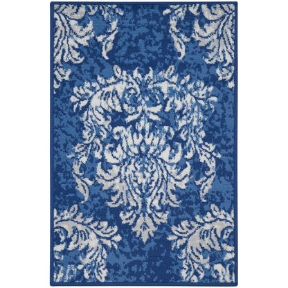 Tapis Nourison Whimsicle style campagne française, motif botanique, ivoire et marine