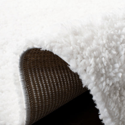 Tapis SAFAVIEH August Wilhelma Shag uni de 3 cm d'épaisseur