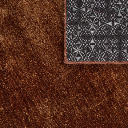 Tapis doux et lavable avec envers antidérapant, disponible en couleurs unies.