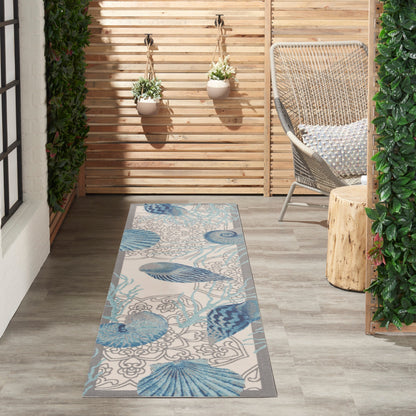 Tapis d'intérieur/extérieur Waverly Sun &amp; Shade Shore Thing Tropical Sea Shell Floral