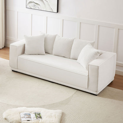 Canapé 3 places rembourré en velours côtelé blanc avec coussins décoratifs