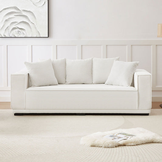 Canapé 3 places rembourré en velours côtelé blanc avec coussins décoratifs
